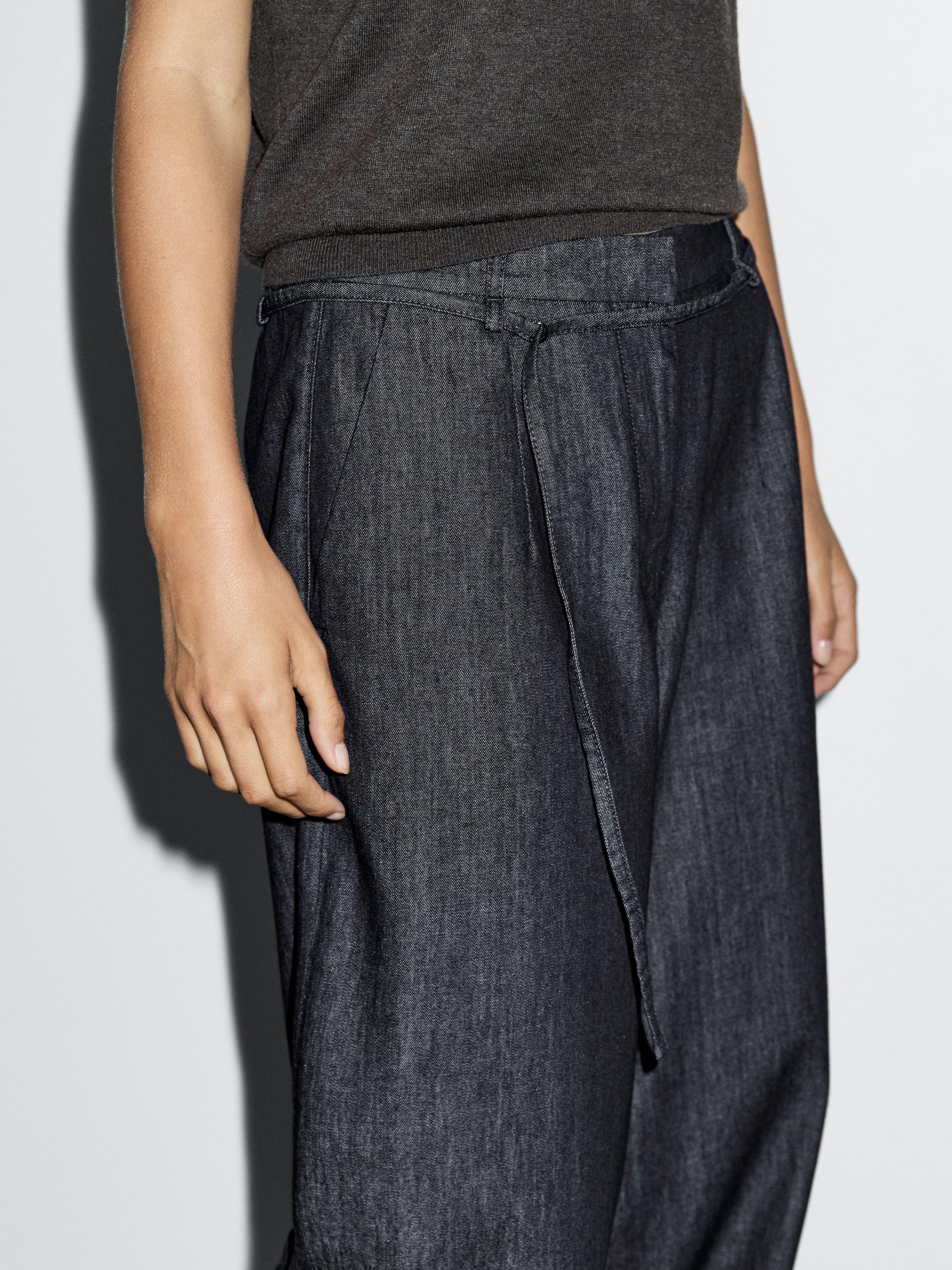 High-waist wide-leg jeans with belt